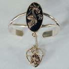 OVAL DRAGON SLAVE BRACELET WITH RING ON CHAIN