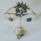 SPIKED SKULL HEAD SLAVE BRACELET WITH RING ON CHAIN